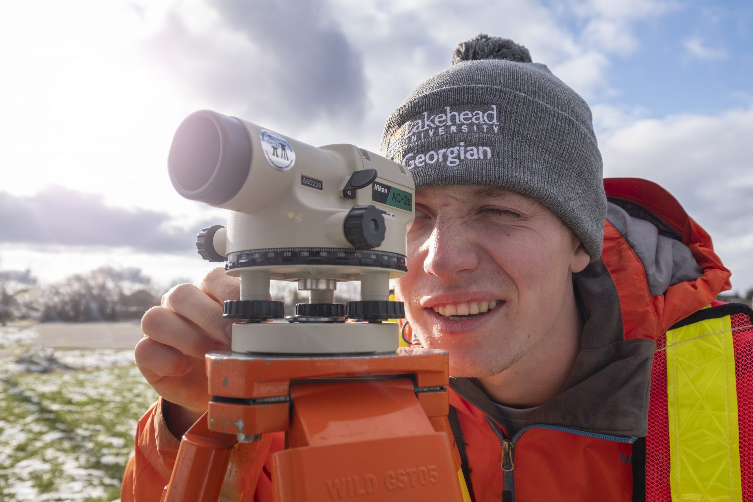 Student looking into survery device