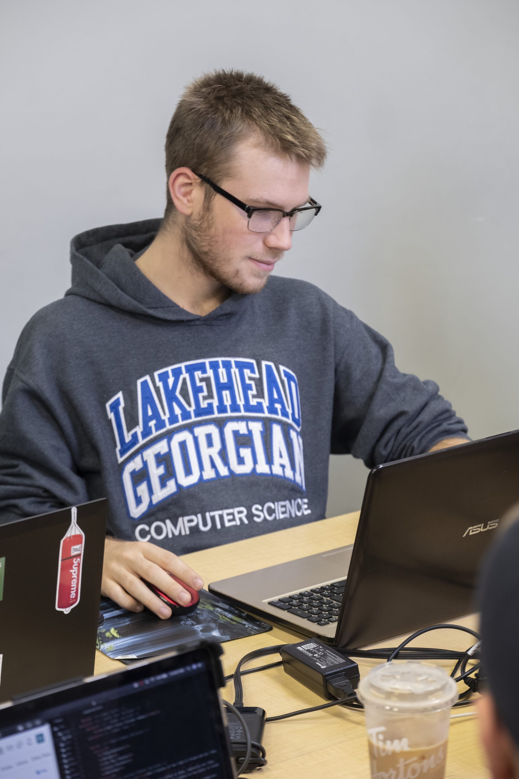 Computer Science student on their laptop